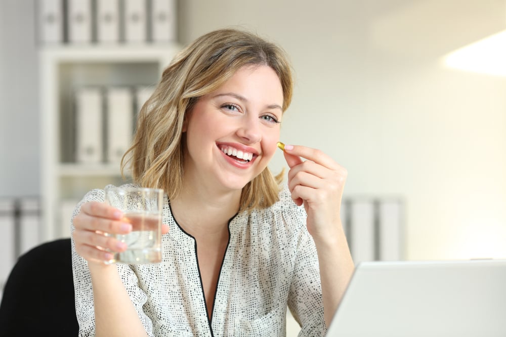 woman taking natural mood boosters