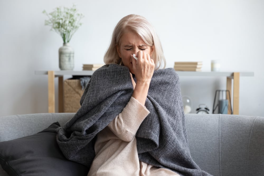 how to boost immune system - older woman sick on couch