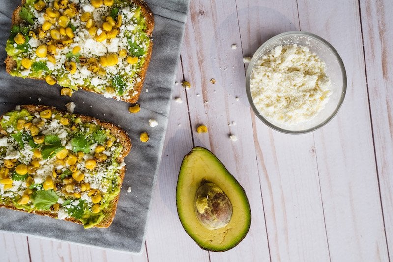 Overhead shot of Street Corn Avocado Toast Recipe With Toast and Fresh Ingredients