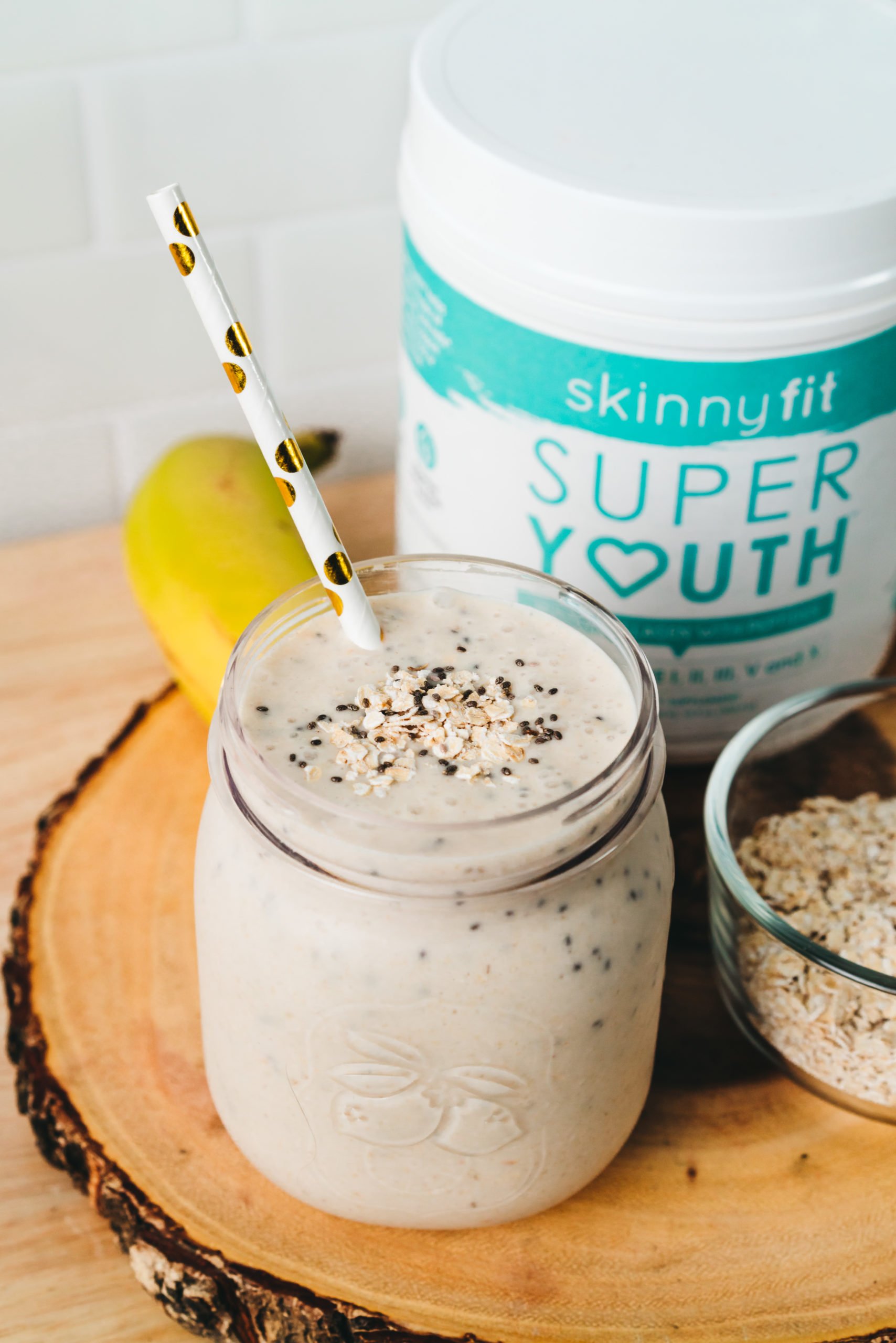 peanut butter banana smoothie close up with SkinnyFit Super Youth collagen peptides and other healthy ingredients 