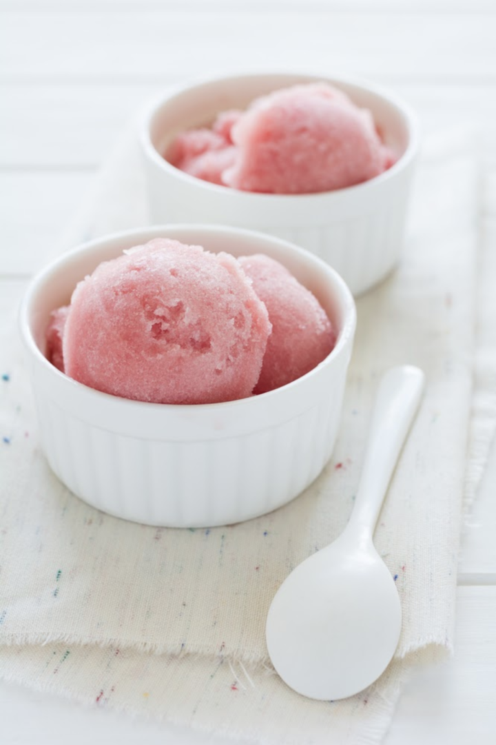 Delicious watermelon sorbet made with Super Youth unflavored collagen in small, white serving bowls.