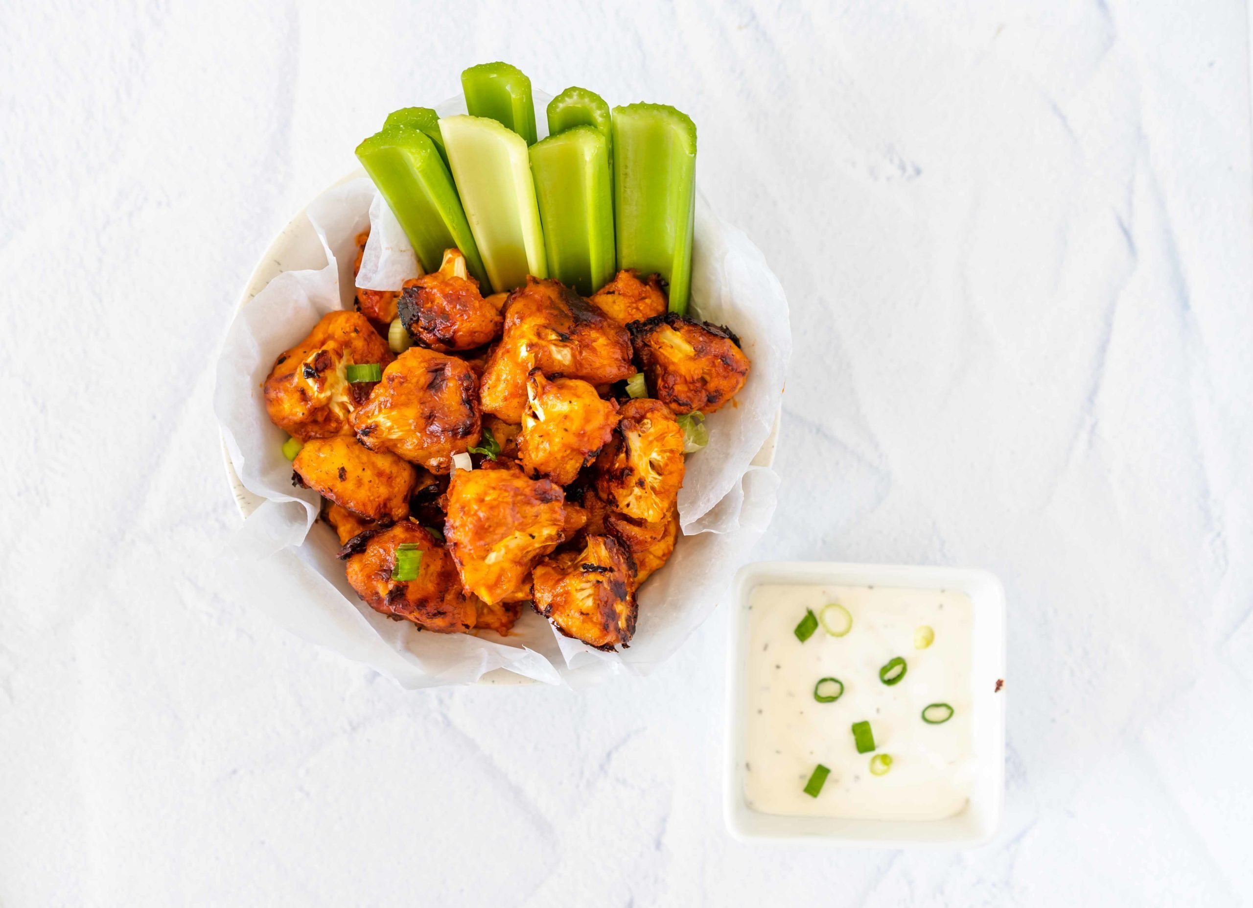 Delicious buffalo cauliflower enhanced with Super Youth Unflavored collagen and served with celery and chive dip