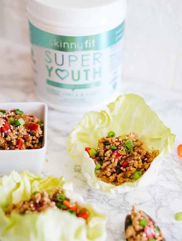 Thai Lettuce Wraps with a container of Super Youth collagen in the background.