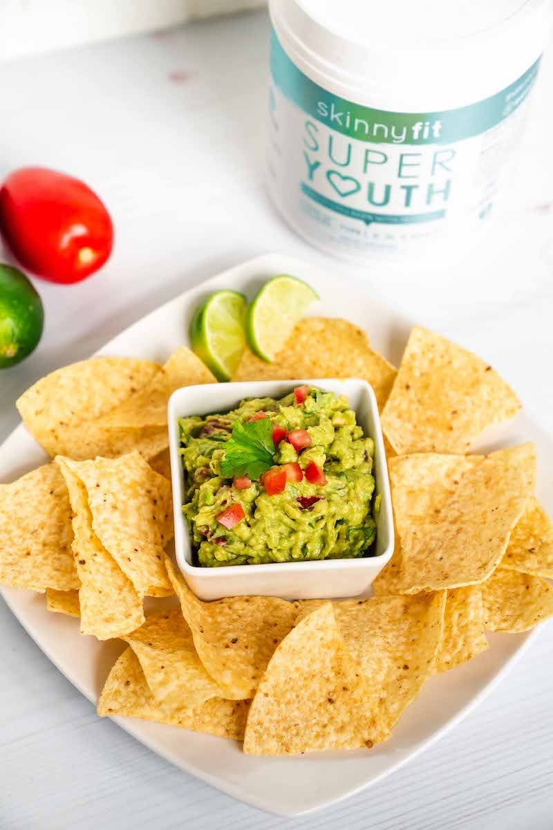 Healthy guacamole recipe with SkinnyFit Super Youth collagen peptides container