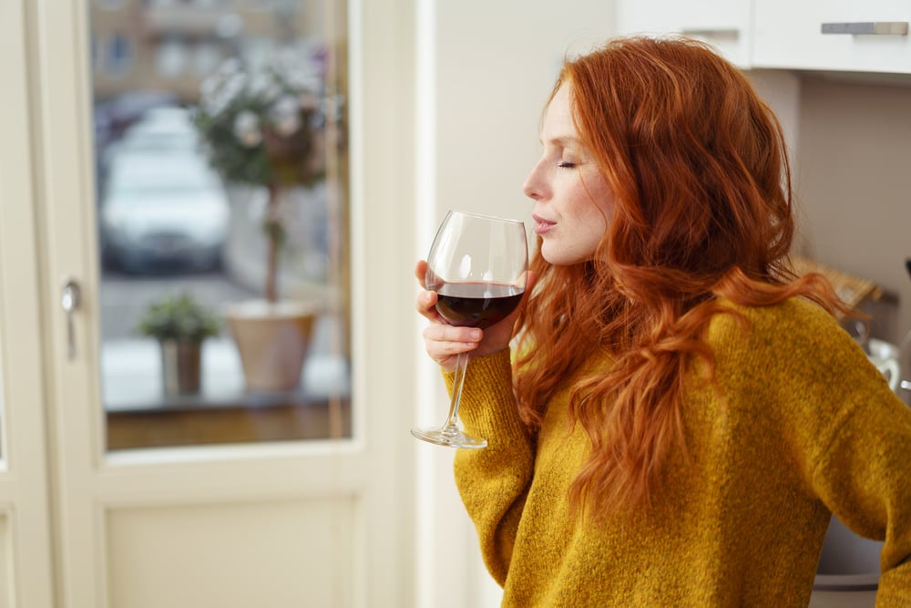 is wine healthy? woman drinking red wine