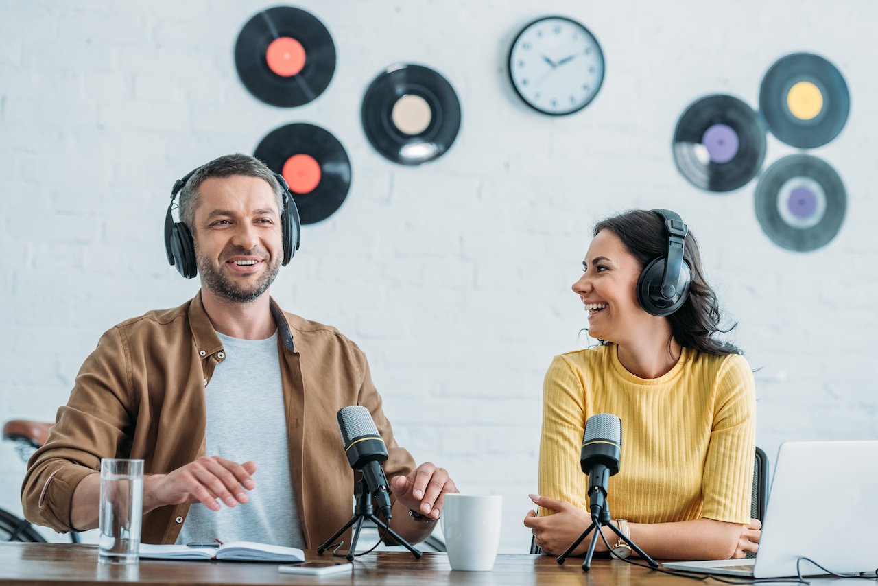 A podcast host and her guest recording a podcast episode