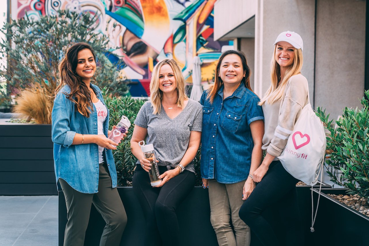 Four members of the SkinnyFit Community, a place women can turn for support for their health goals, including overcoming weight loss plateau.