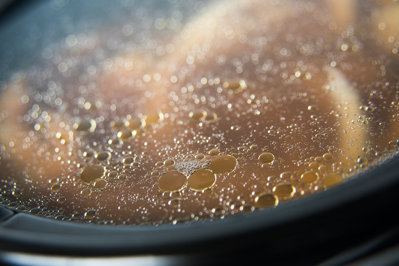 Close up of bone broth collagen, which is not as collagen-rich as SkinnyFIt Super Youth collagen peptides, being boiled.