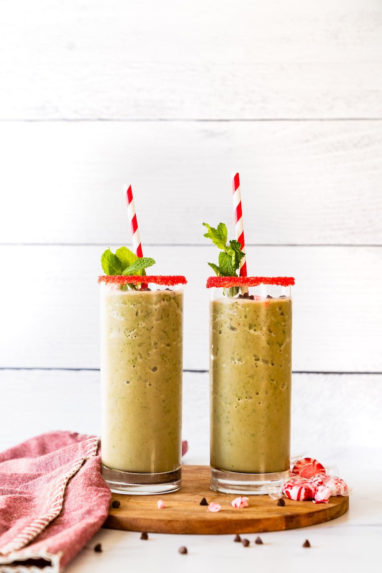 Mint Chocolate Shake With Super Youth Collagen poured into two glasses. The perfect winter-holiday smoothie recipe.