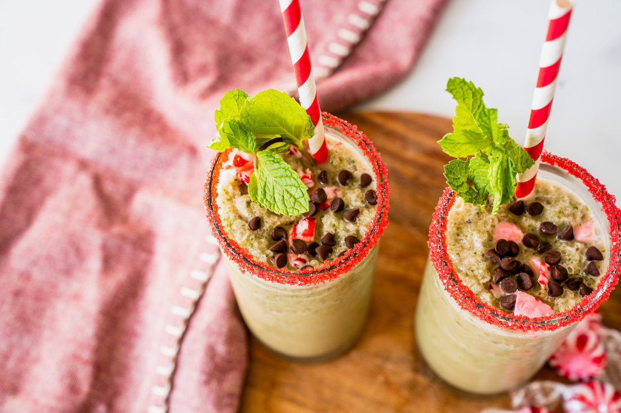 Close up of Mint Chocolate Shake infused with Super Youth chocolate collagen and garnished with fresh mint leaves and cocoa nibs.